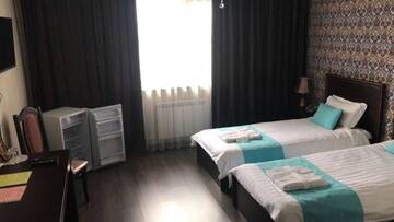 Фото номера Двухместный номер с 2 отдельными кроватями Отель Hotel Bukpa г. Караганда 4