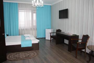 Фото номера Люкс с кроватью размера «king-size» Отель Hotel Bukpa г. Караганда 3